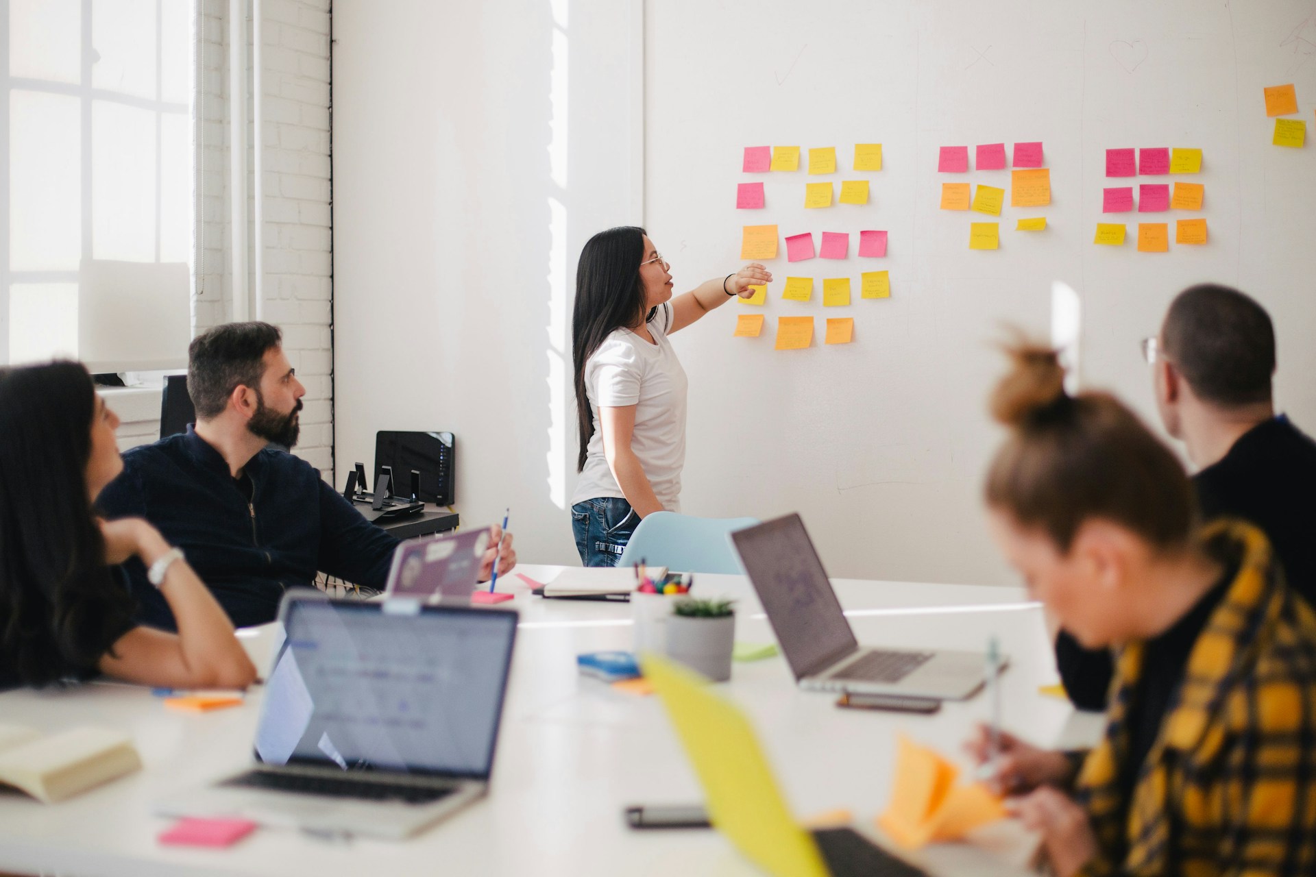 Design team running a sticky-note workshop